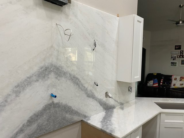 Backsplash and angled sink countertop
